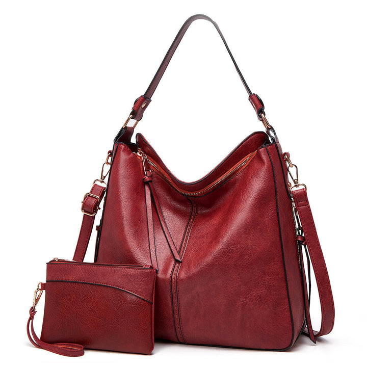 Ersilia™ - Elegant leather bag with large capacity and side pockets